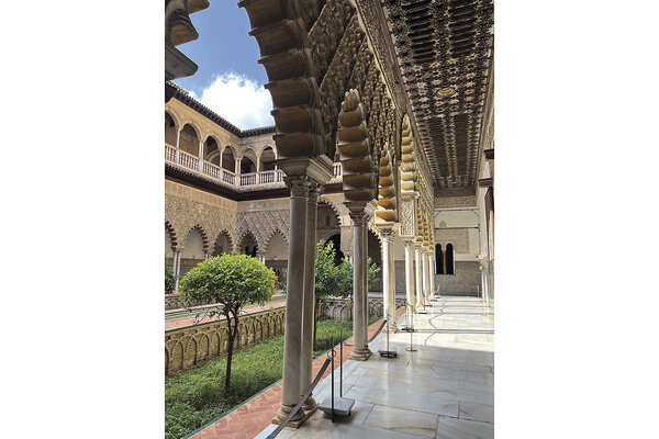 Light illuminates intricate carvings in the Royal Alcázar of Seville, an Islamic-citadel-turned-historic-palace in Spain. 